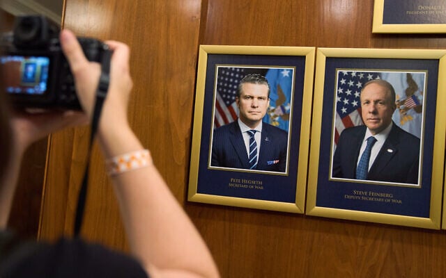 A photographer makes an image of department leadership portraits at the Pentagon, after US President Donald Trump signed an executive order aiming to rename the Department of Defense the Department of War in Washington, September 9, 2025. On the left is Defense Secretary Pete Hegseth and on the right is his deputy Steve Feinberg. (AP Photo/Jacquelyn Martin) A photographer makes an image of department leadership portraits at the Pentagon, after US President Donald Trump signed an executive order aiming to rename the Department of Defense the Department of War in Washington, September 9, 2025. On the left is Defense Secretary Pete Hegseth and on the right is his deputy Steve Feinberg. (AP Photo/Jacquelyn Martin)