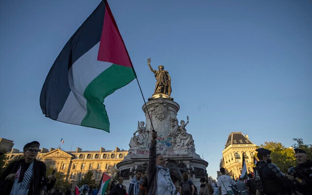 A woman holds a Palestinian flag during a demonstration at Republic Square in Paris, September 17, 2025. (AP Photo/Aurelien Morissard) A woman holds a Palestinian flag during a demonstration at Republic Square in Paris, September 17, 2025. (AP Photo/Aurelien Morissard)