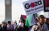 File: Demonstrators hold placards and banners during a pro Palestinian protest as they march through central London, October 11, 2025. (AP Photo/Joanna Chan)