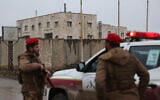 Syrian government forces stand guard at the al-Aqtan prison after taking control of it from the Kurdish-led Syrian Democratic Forces, SDF, in Raqqa, northeastern Syria, January 23, 2026. (AP Photo/Ghaith Alsayed)