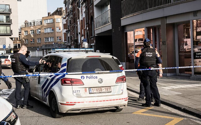 Police secure an area after a blast took place near a synagogue, in Liege, Belgium, March 9, 2026. (AP Photo/Valentin Bianchi)