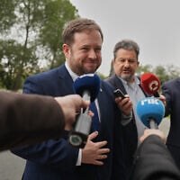 The UK’s Minister of State for the Middle East, North Africa, Afghanistan and Pakistan Stephen Doughty talks to the media after a meeting with Cypriot Foreign Minister Constantinos Kombos at the foreign ministry house in Nicosia, Cyprus, March 19, 2026. (AP Photo/Petros Karadjias)