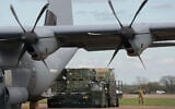 Munitions are unloaded from a cargo plane on the apron at RAF Fairford, England, March 26, 2026. (Alastair Grant/AP)