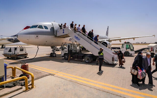 Passengers disembark an Iranian plane in Najaf airport after the end of a flight suspension caused by the regional war that began after US and Israeli strikes on Iran, in Najaf, Iraq, May 8, 2026. (AP Photo/Anmar Khalil) Passengers disembark an Iranian plane in Najaf airport after the end of a flight suspension caused by the regional war that began after US and Israeli strikes on Iran, in Najaf, Iraq, May 8, 2026. (AP Photo/Anmar Khalil)