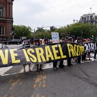 Activists protest near the White House while US President Donald Trump meets with Prime Minister Benjamin Netanyahu in the Oval Office, July 28, 2026, in Washington. (AP Photo/Alex Brandon)