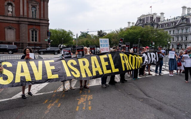 Activists protest near the White House while US President Donald Trump meets with Prime Minister Benjamin Netanyahu in the Oval Office, July 28, 2026, in Washington. (AP Photo/Alex Brandon)