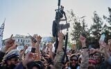 Taliban government supporters cheer during celebrations marking the fifth anniversary of the US withdrawal from Afghanistan and the Taliban’s return to power, in Kabul, Afghanistan, August 15, 2026. (AP Photo/Nava Jamshidi)