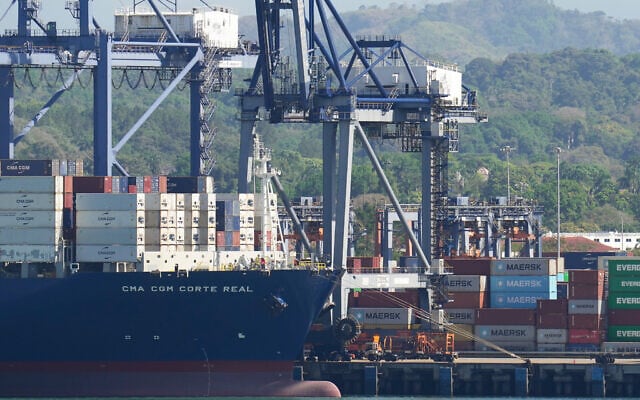 Cranes load a cargo ship at Panama Canal’s Port of Balboa, managed by CK Hutchison Holdings, in Panama City, on January 30, 2026. (AP/Matias Delacroix)