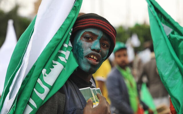 A Houthi supporter paints his face in green and carries a flag during a rally to mark Prophet Muhammad’s birthday, known as Moulid, in Sanaa, Yemen, August 25, 2026. (AP Photo/Osamah Abdulrahman) A Houthi supporter paints his face in green and carries a flag during a rally to mark Prophet Muhammad’s birthday, known as Moulid, in Sanaa, Yemen, August 25, 2026. (AP Photo/Osamah Abdulrahman)