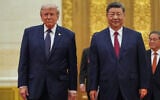 US President Donald Trump, left, and Chinese President Xi Jinping arrive at a state dinner at the Great Hall of the People in Beijing, China, on May 14, 2026. (AP Photo/Mark Schiefelbein)