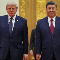 US President Donald Trump, left, and Chinese President Xi Jinping arrive at a state dinner at the Great Hall of the People in Beijing, China, on May 14, 2026. (AP Photo/Mark Schiefelbein)