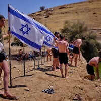 Israelis enjoy a day at an ancient archaeological site known as Herod’s Pool, near the Israeli settlement of Petzael, which was filled with water earmarked for Palestinian farmland, in the West Bank’s Jordan Valley, on June 19, 2026. (AP Photo/Ohad Zwigenberg)