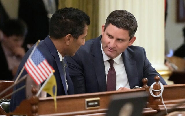 Assembly Speaker Robert Rivas, left, talks with Assemblymember Jesse Gabriel during an Assembly session at the Capitol, August 31, 2026, in Sacramento, California. (AP Photo/Jeff Chiu)