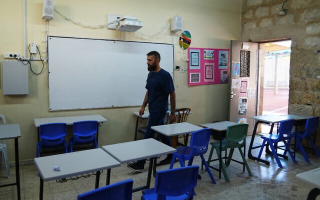 Teacher Hussam Nmir checks a classroom at Saint George’s School in East Jerusalem, September 1, 2026, as Christian schools in Jerusalem suspended classes alleging Israeli authorities did not renew work permits for teachers and staff from the West Bank (AP Photo/Mahmoud Illean) Teacher Hussam Nmir checks a classroom at Saint George’s School in East Jerusalem, September 1, 2026, as Christian schools in Jerusalem suspended classes alleging Israeli authorities did not renew work permits for teachers and staff from the West Bank (AP Photo/Mahmoud Illean)