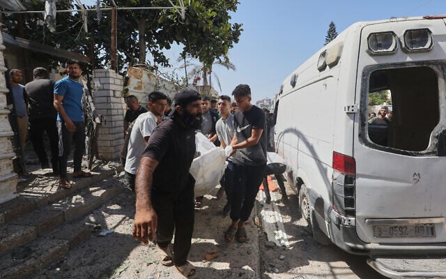 Palestinians carry the lifeless body of a person following an Israeli military strike in Gaza City, September 1, 2026. (AP Photo/Yousef Al Zanoun)