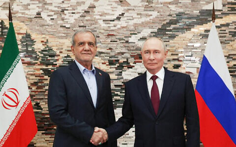 Russian President Vladimir Putin, right, and Iranian President Masoud Pezeshkian pose for a photo during their meeting on the sidelines of the Shanghai Cooperation Organization (SCO), in Bishkek, Kyrgyzstan, on September 1, 2026. (Vyacheslav Prokofyev, Sputnik, Kremlin Pool Photo via AP)