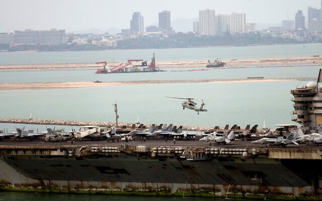 A helicopter lands on the US Navy aircraft carrier USS Abraham Lincoln after it arrived at the port in Laem Chabang, Chonburi, Thailand, September 2, 2026. (AP Photo/Sakchai Lalit)