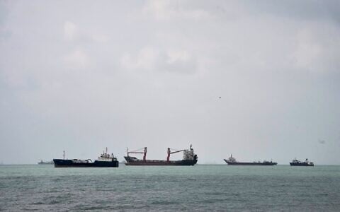 Commercial vessels lie anchored in the Strait of Hormuz off Bandar Abbas, Iran, September 4, 2026. (AP Photo/Vahid Salemi)