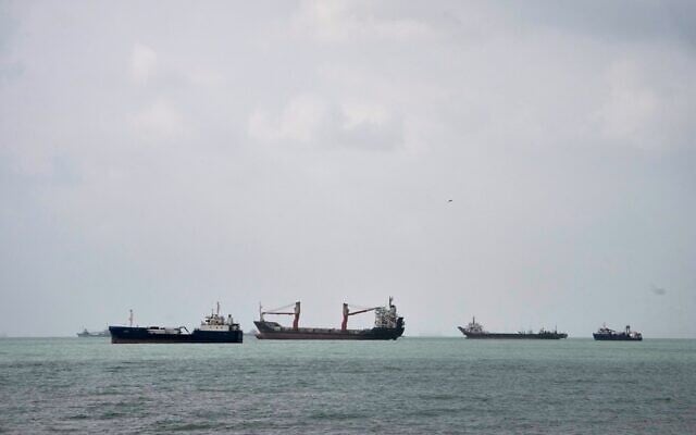 Commercial vessels lie anchored in the Strait of Hormuz off Bandar Abbas, Iran, September 4, 2026. (AP Photo/Vahid Salemi)