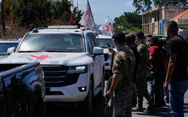 A Red Cross convoy escorts four released prisoners who were held in Israeli prisons as they arrive in the southern village of Mansouri, Lebanon, September 4, 2026. (AP Photo/Mohammed Zaatari)