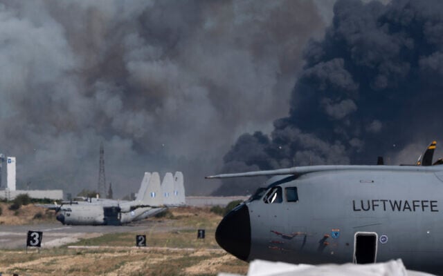 Smoke rises after a Hellenic Air Force F-4 Phantom fighter jet crashed, during the Athens Flying Week airshow at Tanagra Air Force Base, north of Athens, Greece, September 5, 2026. (AP Photo) Smoke rises after a Hellenic Air Force F-4 Phantom fighter jet crashed, during the Athens Flying Week airshow at Tanagra Air Force Base, north of Athens, Greece, September 5, 2026. (AP Photo)
