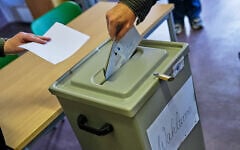 A man votes at a polling station during the Saxony-Anhalt state elections in Tangermuende, eastern Germany, September 6, 2026. (AP Photo/Matthias Schrader)