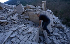A man searches in the rubble of a destroyed house that was hit by an Israeli airstrike in Arab Salim village, southern Lebanon, September 6, 2026. (AP Photo/Mohammed Zaatari)