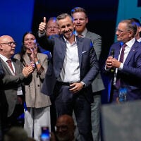 Top candidate Ulrich Siegmund shows thumbs up beside his wife Julia, left, and party leaders Tino Chrupalla and Alice Weidel, right, at an election party of the “Alternative for Germany” (AfD) after the Saxony-Anhalt state elections in Magdeburg, eastern Germany, September 6, 2026. (AP Photo/Matthias Schrader)