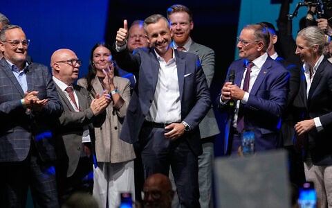 Top candidate Ulrich Siegmund shows thumbs up beside his wife Julia, left, and party leaders Tino Chrupalla and Alice Weidel, right, at an election party of the “Alternative for Germany” (AfD) after the Saxony-Anhalt state elections in Magdeburg, eastern Germany, September 6, 2026. (AP Photo/Matthias Schrader)