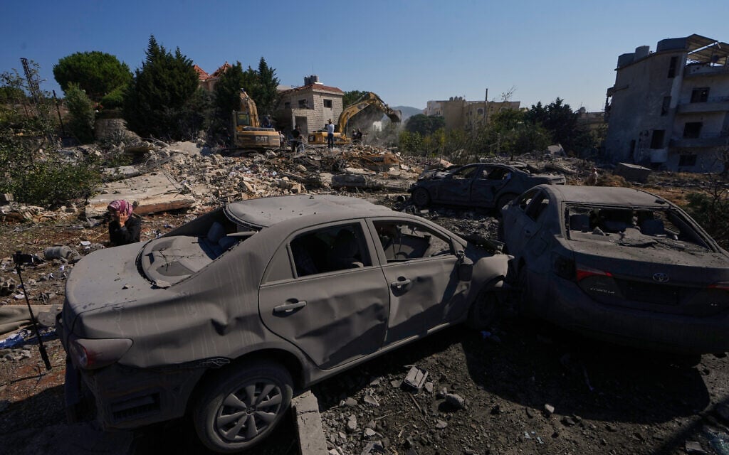 Rescue workers search for victims under the rubble of a building destroyed in an Israeli airstrike in the southern village of Kfar Rumman, Lebanon, September 7, 2026. (AP Photo/Mohammed Zaatari)