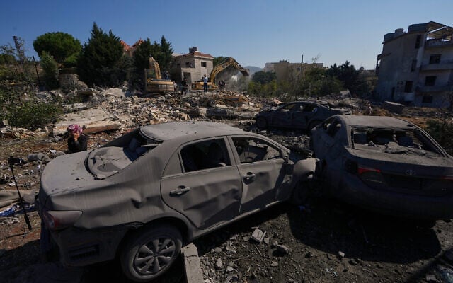 Rescue workers search for victims under the rubble of a building destroyed in an Israeli airstrike in the southern village of Kfar Rumman, Lebanon, September 7, 2026. (AP Photo/Mohammed Zaatari)