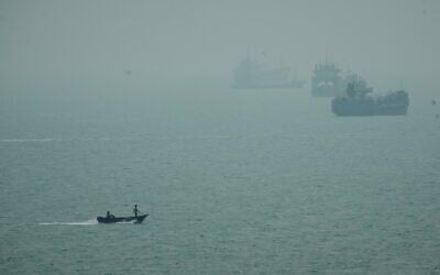 A motorboat travels past commercial vessels anchored amid haze in the Strait of Hormuz off Bandar Abbas, Iran, September 7, 2026. (AP Photo/Vahid Salemi) A motorboat travels past commercial vessels anchored amid haze in the Strait of Hormuz off Bandar Abbas, Iran, September 7, 2026. (AP Photo/Vahid Salemi)