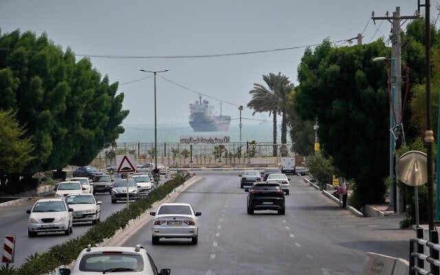 Traffic moves along an avenue as a commercial vessel lies anchored in the Strait of Hormuz off Bandar Abbas, Iran, September 7, 2026. (AP Photo/Vahid Salemi) Traffic moves along an avenue as a commercial vessel lies anchored in the Strait of Hormuz off Bandar Abbas, Iran, September 7, 2026. (AP Photo/Vahid Salemi)