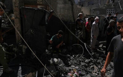 Palestinians inspect a building destroyed in an Israeli airstrike in Gaza City, September 9, 2026. (AP Photo/Jehad Alshrafi) Palestinians inspect a building destroyed in an Israeli airstrike in Gaza City, September 9, 2026. (AP Photo/Jehad Alshrafi)