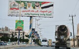 A billboard showing from right to left, Saudi King Salman, Crown Prince Mohammed bin Salman and Yemen President Rashad Mohammed Al-Alimi is erected at a main street in Mahra, Yemen, September 9, 2026. (AP Photo/Abdulnasser Alseddik)