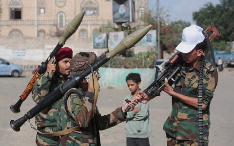 Yemen’s Houthi rebels chat as they check their weapons during a mobilization campaign in Sanaa, Yemen, September 10, 2026. (AP Photo)