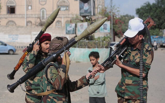 Yemen’s Houthi rebels chat as they check their weapons during a mobilization campaign in Sanaa, Yemen, September 10, 2026. (AP Photo)