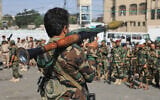 A fighter with Yemen’s Houthi rebels carries a rocket-propelled grenade launcher as they march during a mobilization campaign in Sanaa, Yemen, September 10, 2026. (AP Photo)