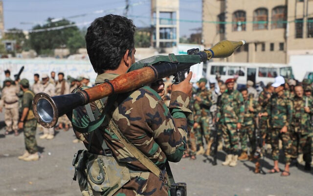 A fighter with Yemen’s Houthi rebels carries a rocket-propelled grenade launcher as they march during a mobilization campaign in Sanaa, Yemen, September 10, 2026. (AP Photo)