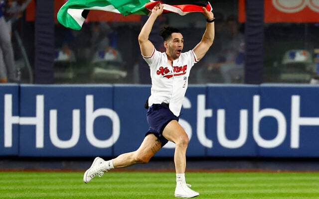 A man runs onto the field waving a Palestinian flag during the seventh inning of a baseball game between the New York Yankees and New York Mets, at Yankee Stadium in New York on September 11, 2026. (AP Photo/Noah K. Murray) A man runs onto the field waving a Palestinian flag during the seventh inning of a baseball game between the New York Yankees and New York Mets, at Yankee Stadium in New York on September 11, 2026. (AP Photo/Noah K. Murray)