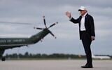 US President Donald Trump waves after disembarking Air Force One on arrival at Shannon Airport in Shannon, Ireland, September 12, 2026. (AP Photo/Julia Demaree Nikhinson)