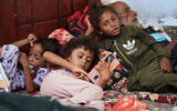 Displaced Yemenis rest at a temporary shelter in the Dar Saad district of Aden, Yemen, September 12, 2026, after fleeing Houthi attacks in the western coastal cities of al-Khokha and Mokha. (AP Photo/Abdulnasser Alseddik)