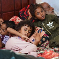 Displaced Yemenis rest at a temporary shelter in the Dar Saad district of Aden, Yemen, September 12, 2026, after fleeing Houthi attacks in the western coastal cities of al-Khokha and Mokha. (AP Photo/Abdulnasser Alseddik)