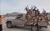 This image taken from undated video released by Al-Masirah TV, a channel owned by Yemen’s Houthi rebels, on September 11, 2026, shows, according to the channel, Houthi fighters chanting atop a pickup truck in Khawkhah, Hodeida province, Yemen. (Al-Masirah TV via AP)