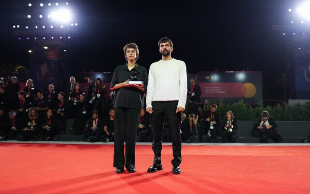 Directors Rachel Szor, left, and Yuval Abraham, winners of the special jury prize for the film ‘NAZA’, pose for photographers at the awards photo call during the closing ceremony of the 83rd edition of the Venice Film Festival in Venice, Italy, on September 12, 2026. (Scott A Garfitt/Invision/AP)