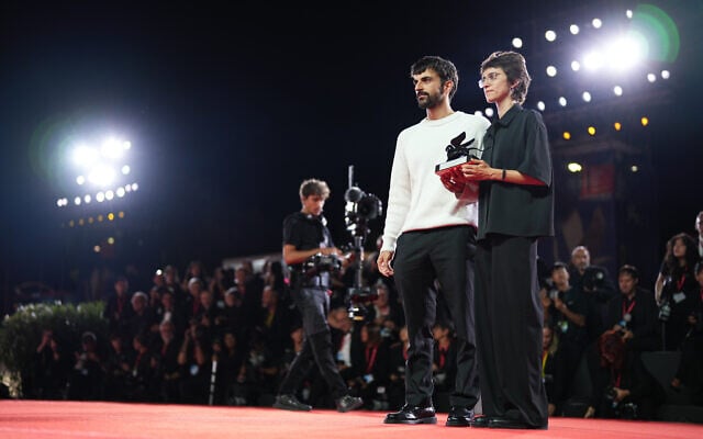 Directors Yuval Abraham (left) and Rachel Szor, winners of the special jury prize for the film ‘Naza’, pose for photographers at the awards photo call during the closing ceremony of the 83rd edition of the Venice Film Festival in Venice, Italy, on September 12, 2026. (Scott A Garfitt/Invision/AP)
