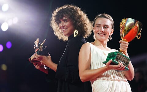 Mathilde Arcel, right, winner of the Coppa Volpi for best actress for the film ‘Woman Unknown,’ and the director May el-Toukhy, winner of the Golden Lion for best film, pose for photographers at the awards photo call during the closing ceremony of the 83rd edition of the Venice Film Festival in Venice, Italy, on September 12, 2026. (Scott A Garfitt/Invision/AP)