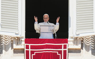 Pope Leo XIV blesses faithful during the Angelus noon prayer from the window of his studio overlooking St.Peter’s Square, at the Vatican, September 13, 2026. (AP Photo/Alessandra Tarantino)
