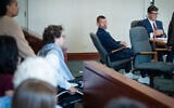 Jason Eaton watches as Hisham Awartani arrives to testify in Eaton’s trial in Burlington, Vt., September 14, 2026. (Glenn Russell/Pool photo via AP)