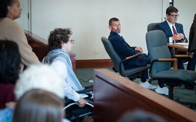 Jason Eaton watches as Hisham Awartani arrives to testify in Eaton’s trial in Burlington, Vt., September 14, 2026. (Glenn Russell/Pool photo via AP)